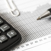 Canva – Calculator and Pen on Table